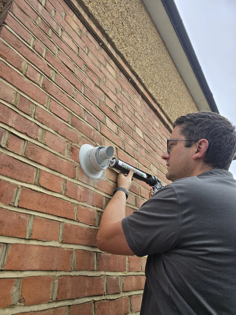 Richard carrying out heating work