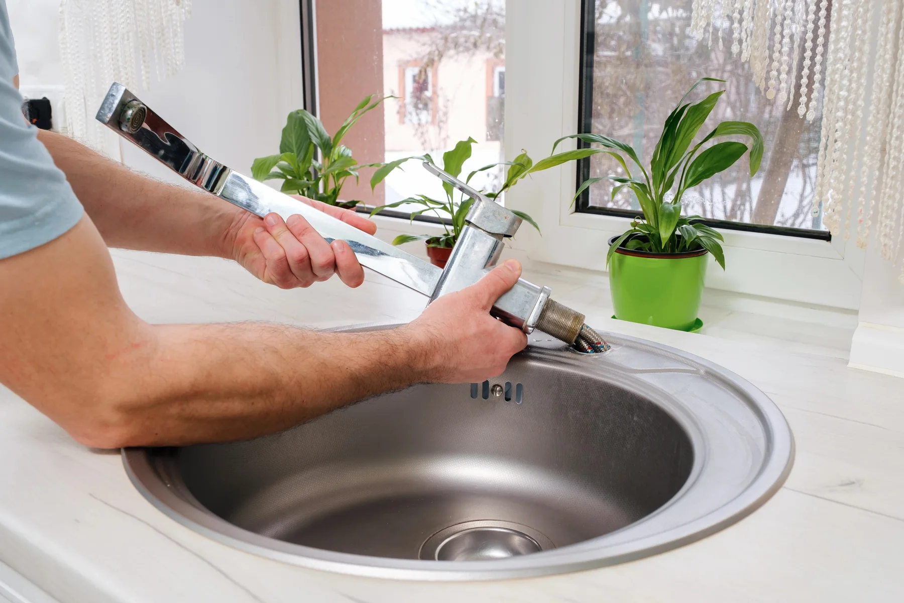 New kitchen tap being installed