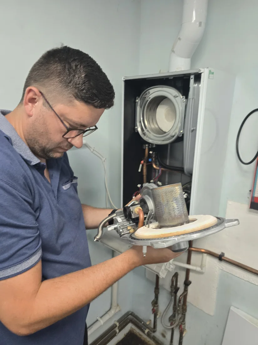 Boiler burner being inspected during a service